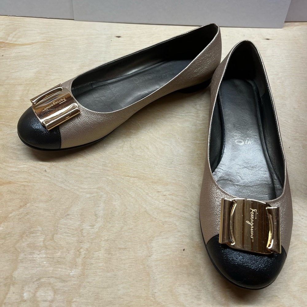 Classic Ferragamo flats in gold and black. Size 8. Comes with original box